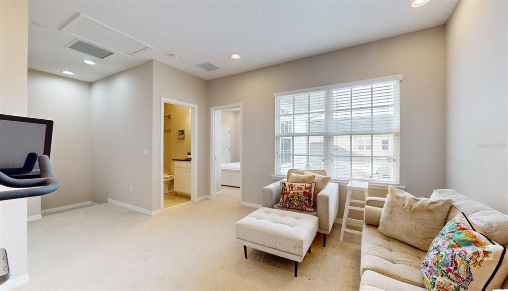 Second level Loft with view to full bathroom. Laundry Closet to the Left.