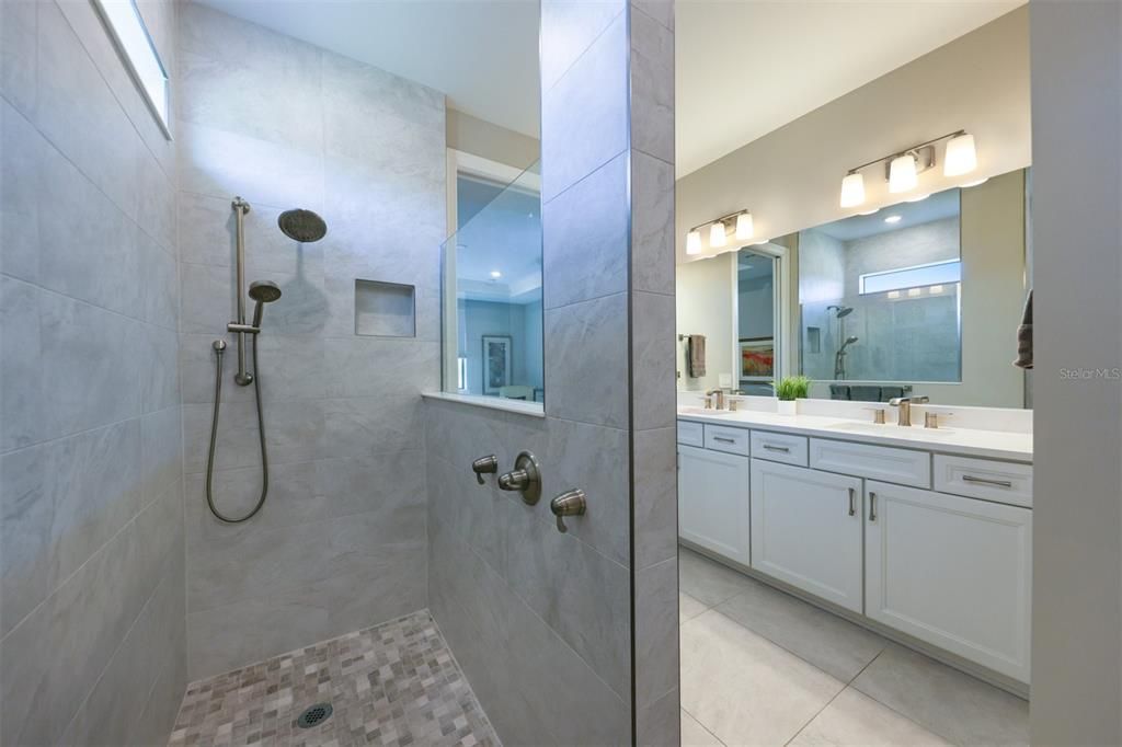 Dual shower heads in spacious master bath shower