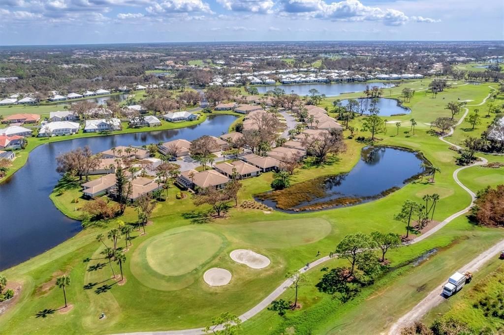 The backyard features a pond and the #12 fairway and green