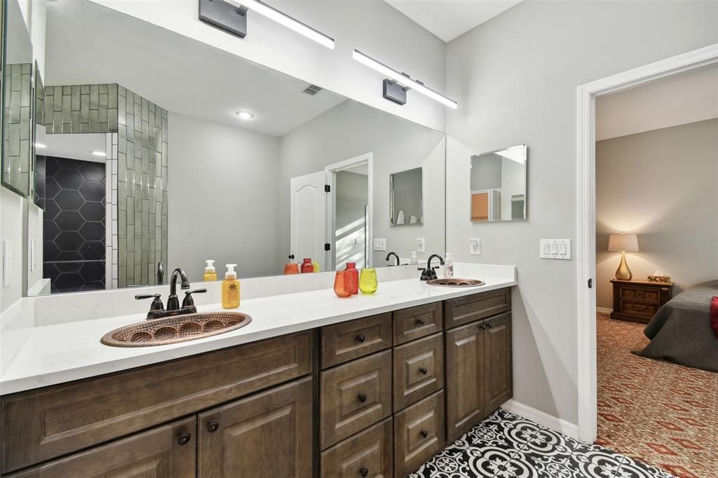 looks at those gorgeous vessel sinks against this beautiful tile flooring