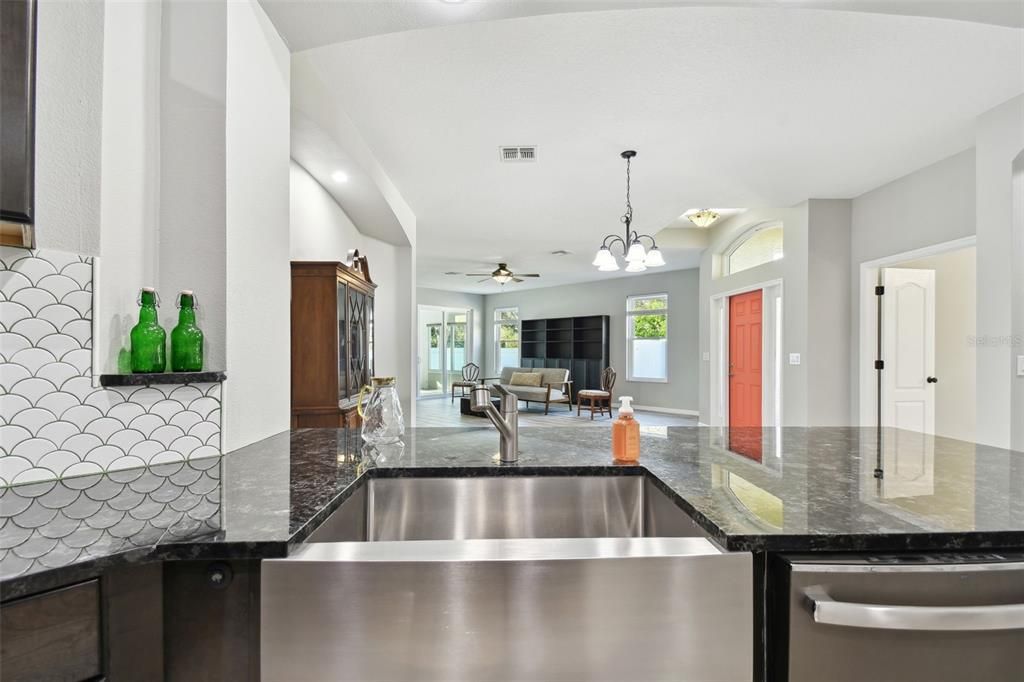 open view from kitchen into great room and even the Florida room