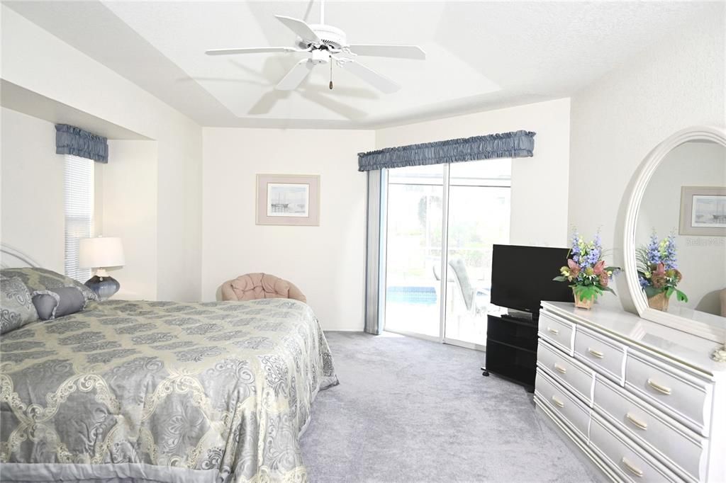 Primary Bedroom with sitting area and pool access