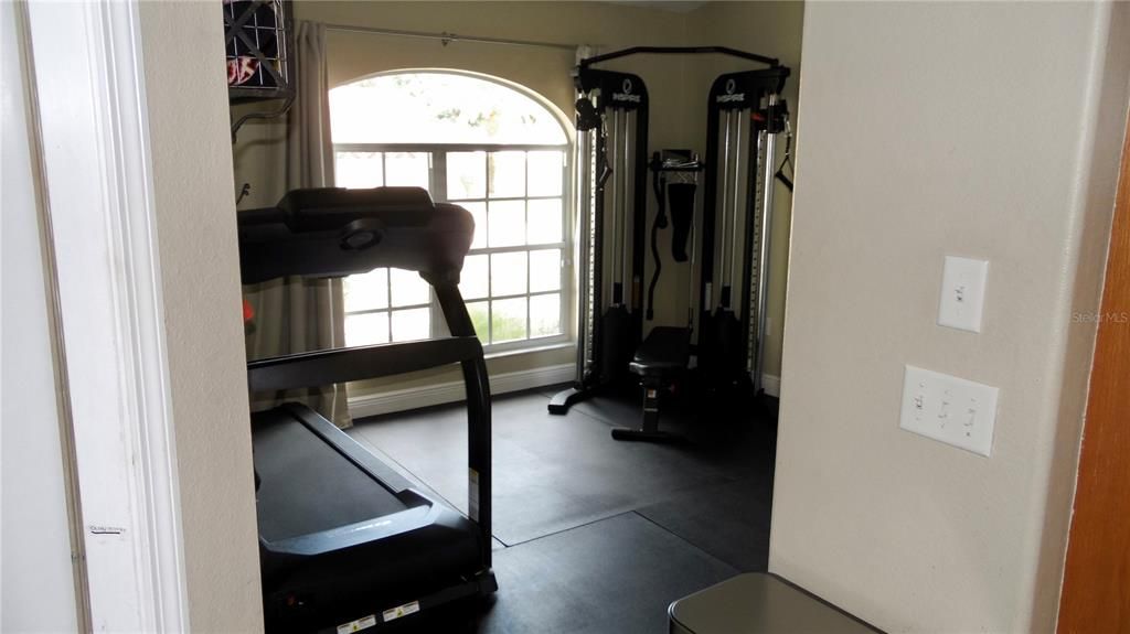 Dining room used as flex space and currently used as a gym