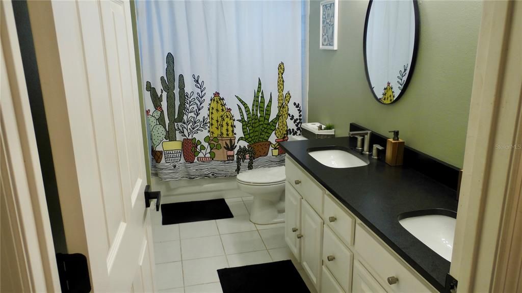 Hall bathroom with double vanity