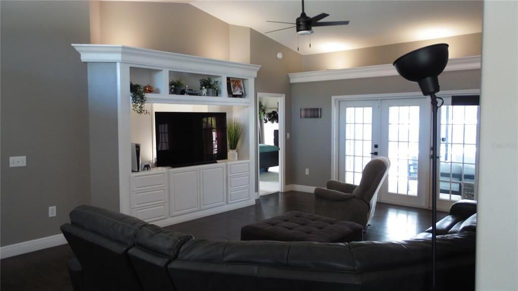 Large family room with french doors to pool