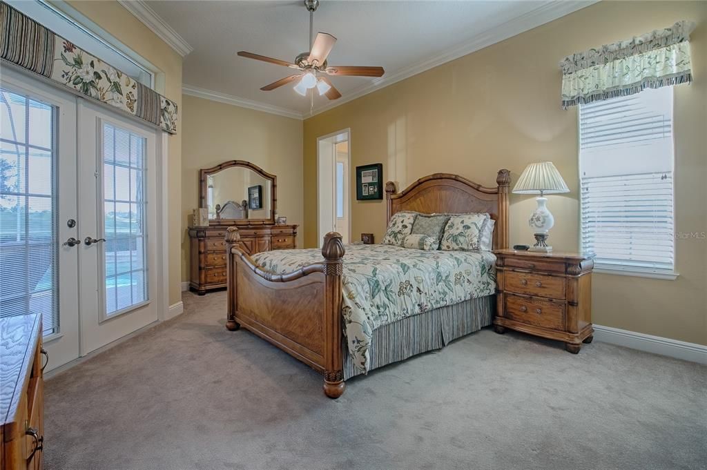 Guest bedroom Exit doors to lanai and patio area