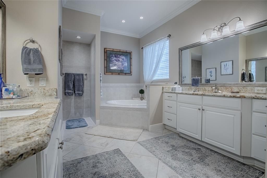 Master bath, it’s soaking tub and shower