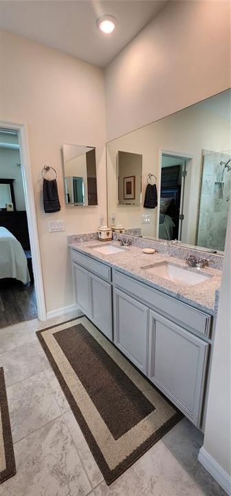 Main Bath w/double sinks and tile floors