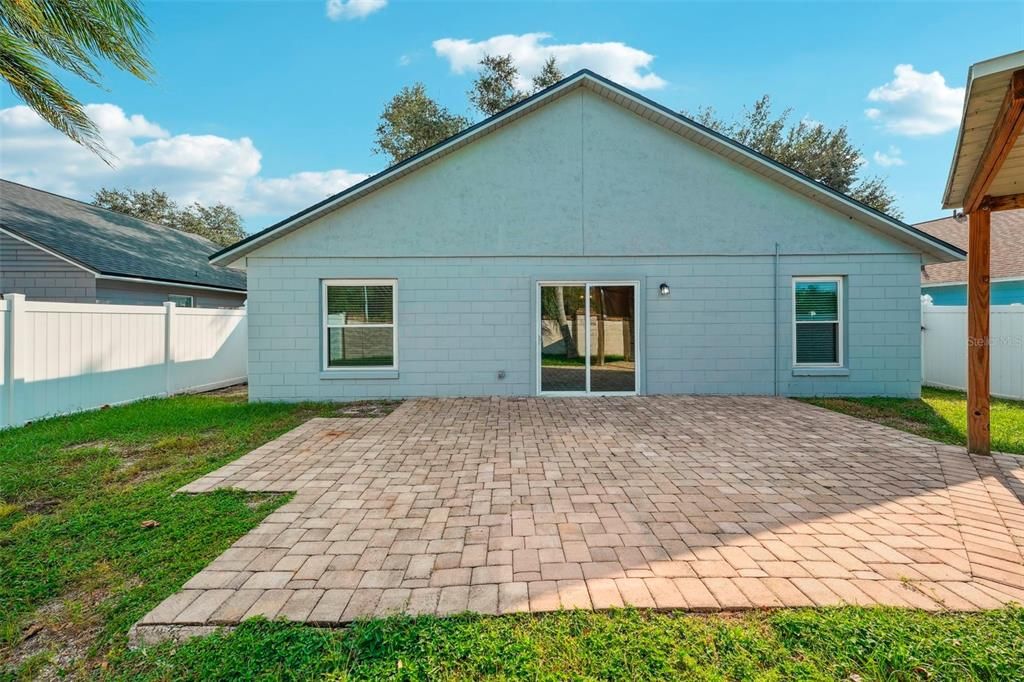 Outside you will find a paver patio that extends into a wood pergola perfect for entertaining family and friends.