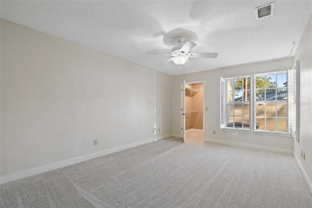 Walk in closet for the primary first floor bedroom