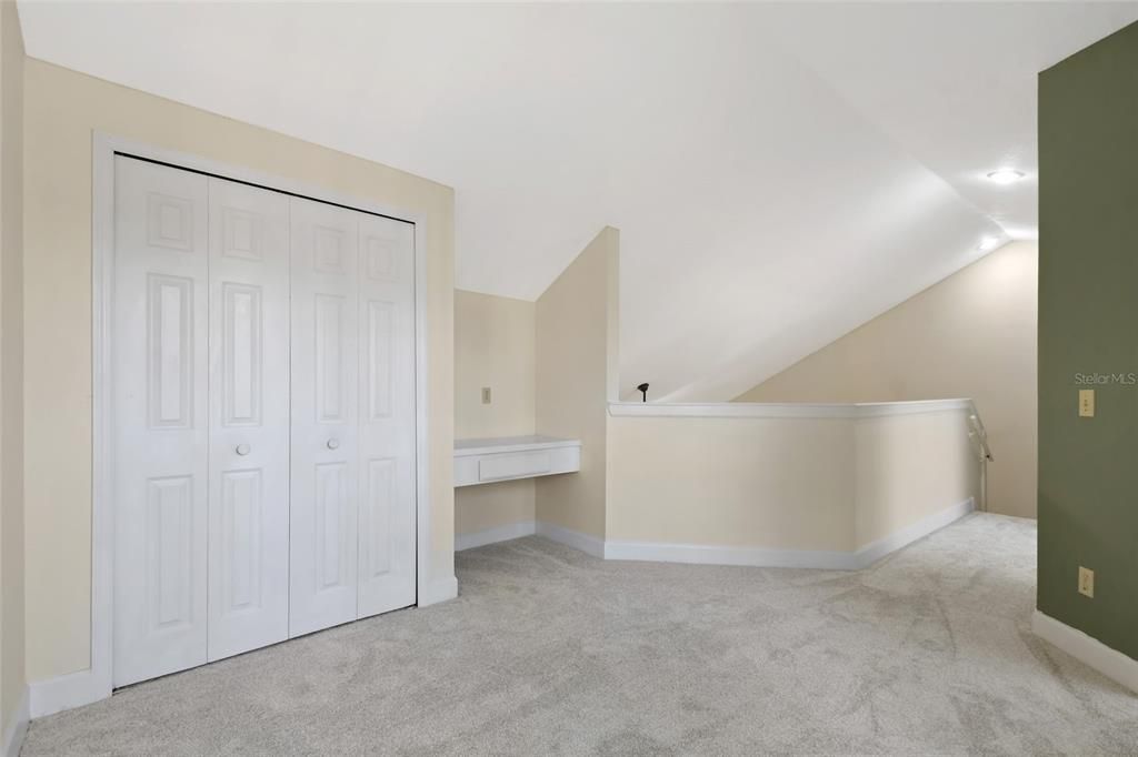 Once upstairs you are greeted by the open loft space with vaulted ceiling.