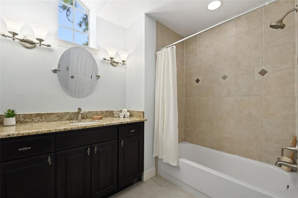 2nd Bathroom has granite counters, shower/tub combination and oversized vanity for plenty of storage.