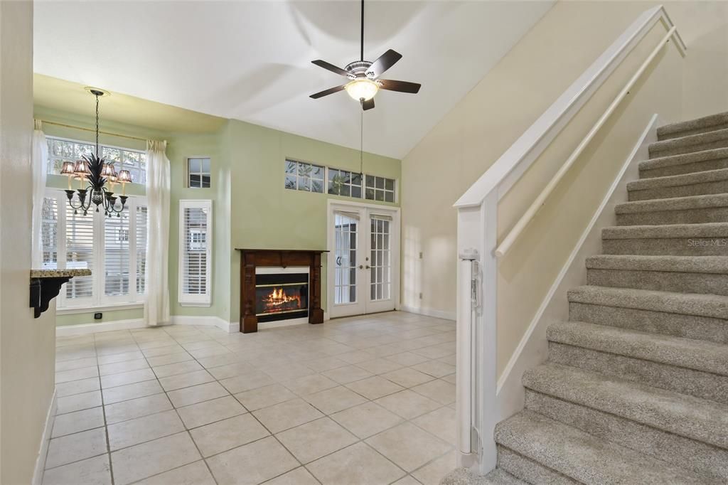 Full of natural light! The family room/breakfast nook area flow with vaulted ceilings providing that volume and spaciousness that are important in this townhouse style condominium