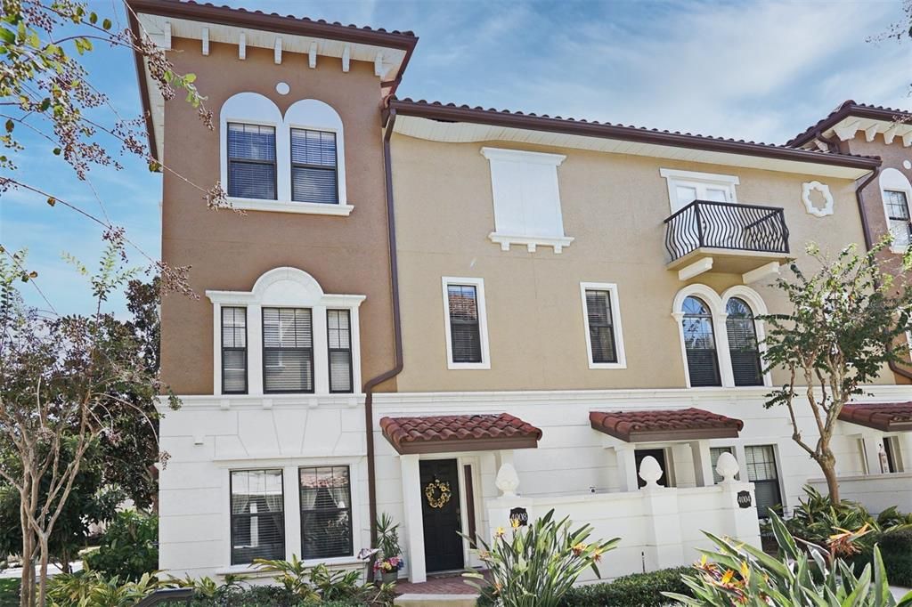 End unit with cute front porch.