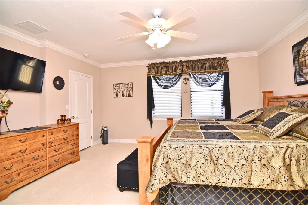 Master bedroom with good wall space to handle your dressers, and the TV will remain.