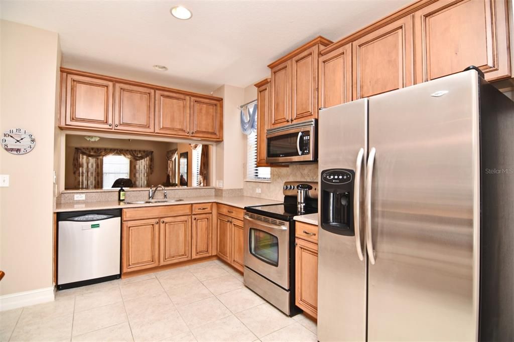 You won't be isolated in your kitchen.  A large pass through gives access to the great room.