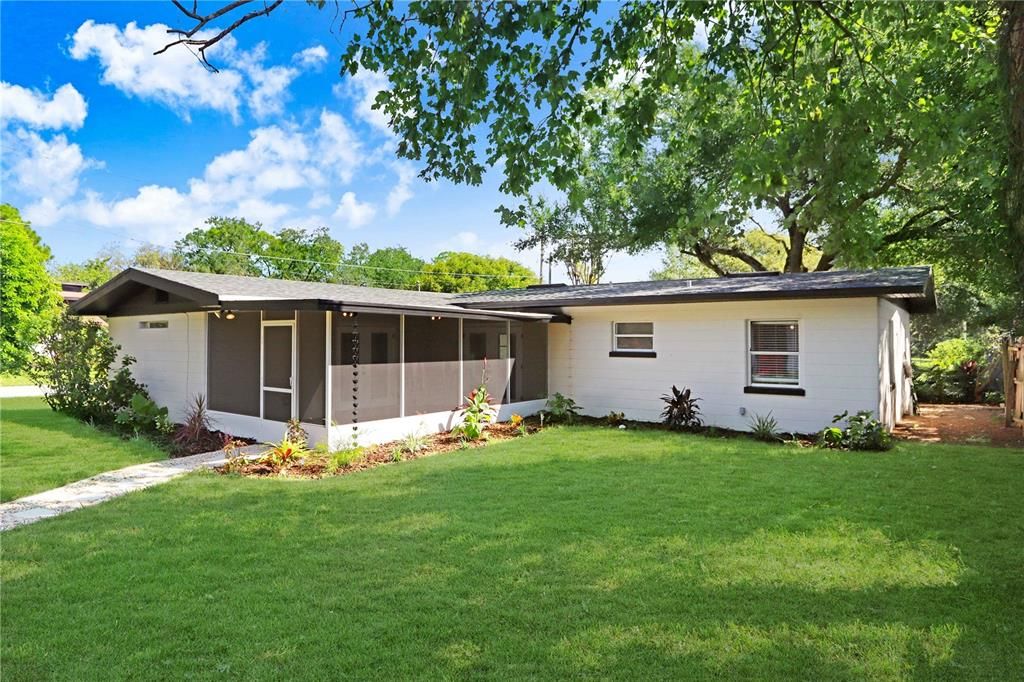 Exterior View of Main Dwelling Backyard Open Grass Area