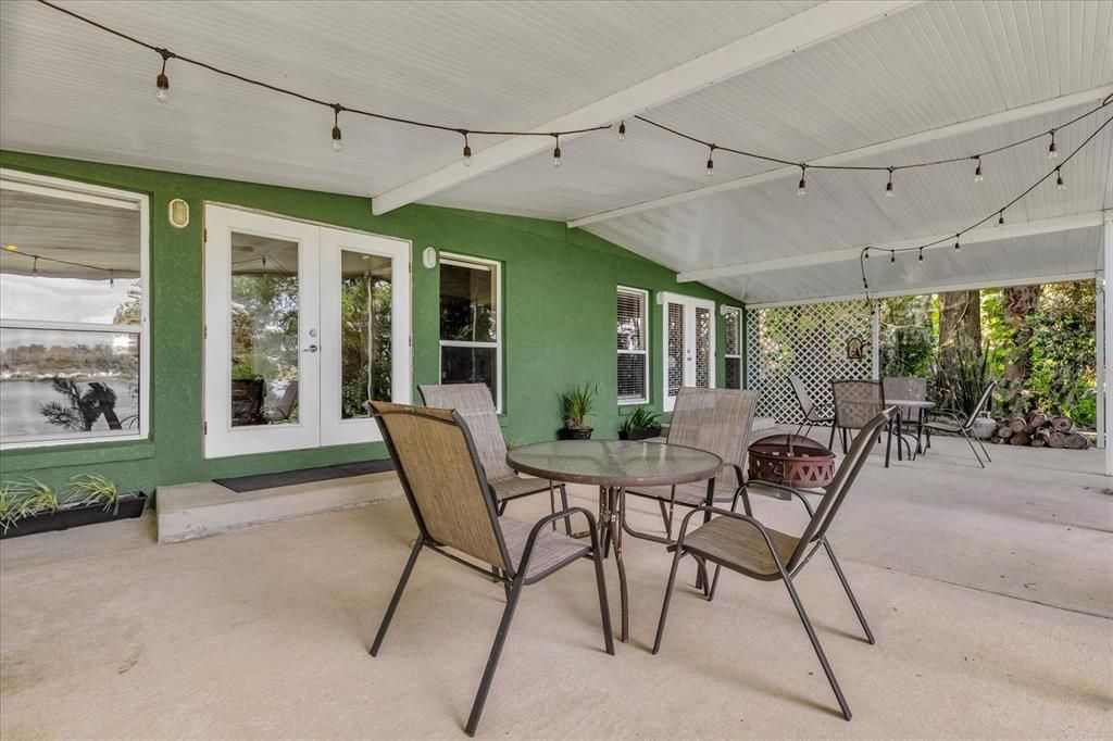 Large rear covered porch with views of Lake Arnold