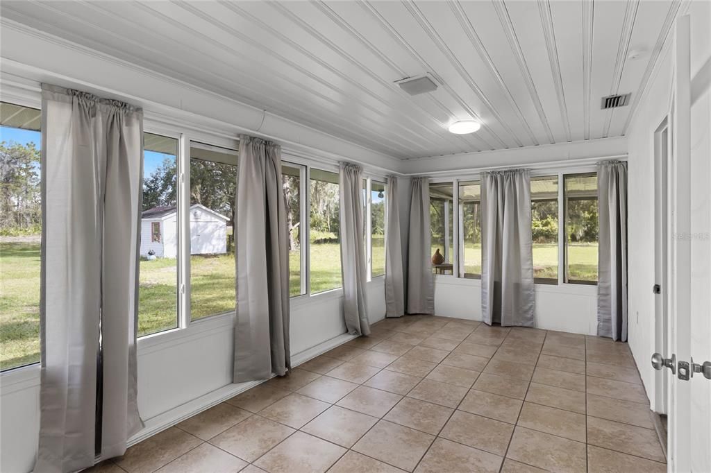 Formal Dining Room is adorned with Beadboard Ceiling