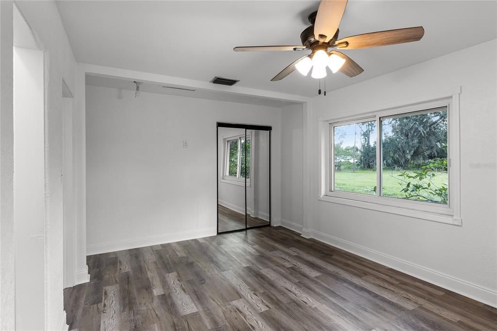 Primary Bedroom features a Walk-in Closet with Closet Organizer System