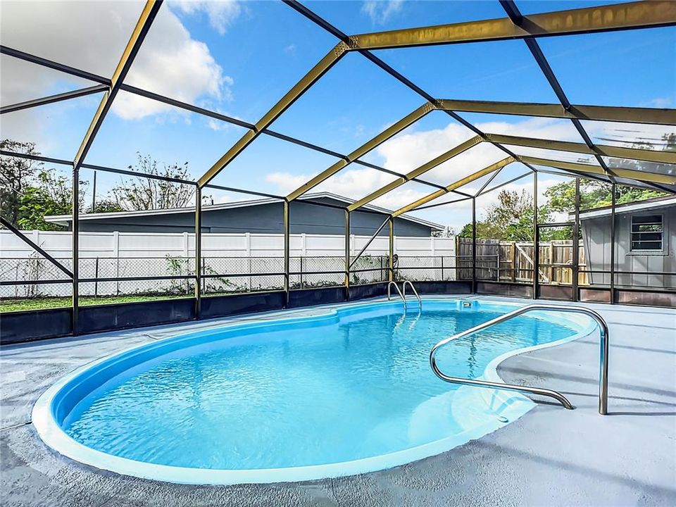 large lanai cover pool and cement deck area