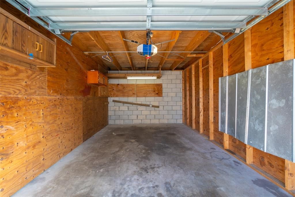 One car garage with an electronic door opener.