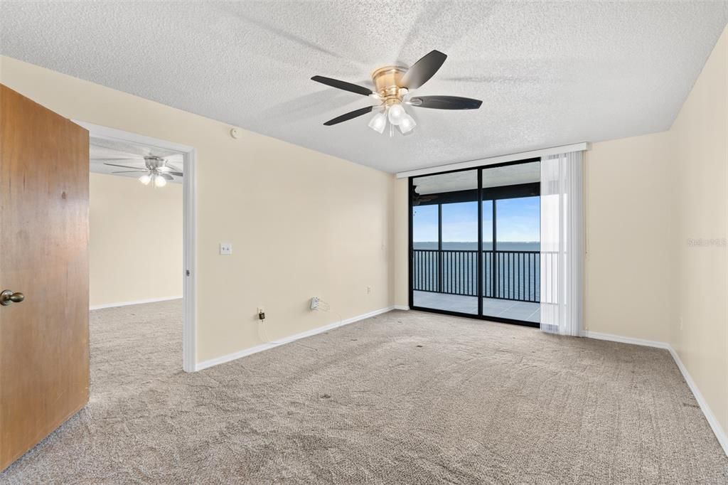 Cozy master bedroom with walk-in closet and access to the balcony.