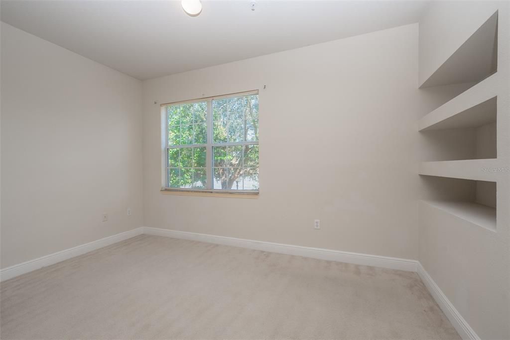 Built in shelving in bonus office / playroom space attached to living room