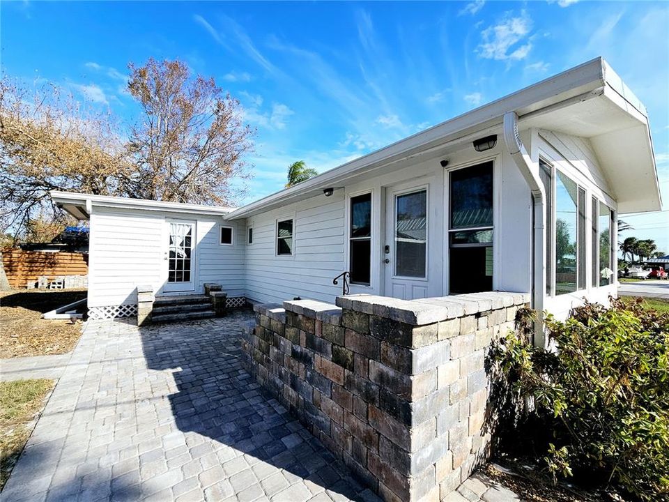 Back of cottage with paver deck & walkway