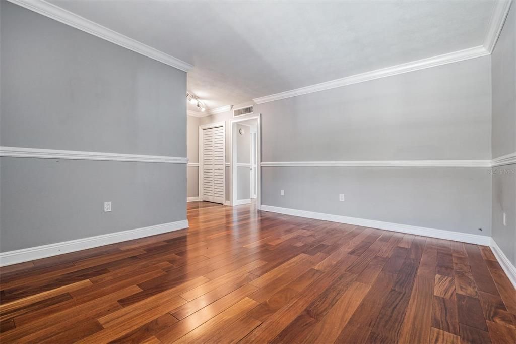 Spacious living room - with classy crown & chair rail molding.