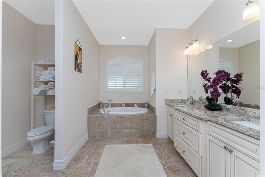 Double sink wood vanity with level 5 granite