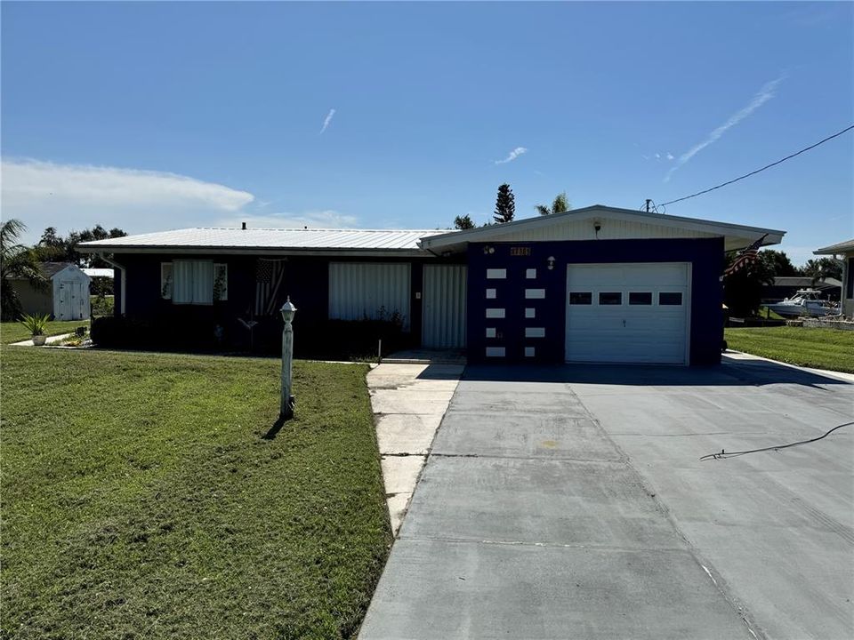 Front of home with hurricane shutters