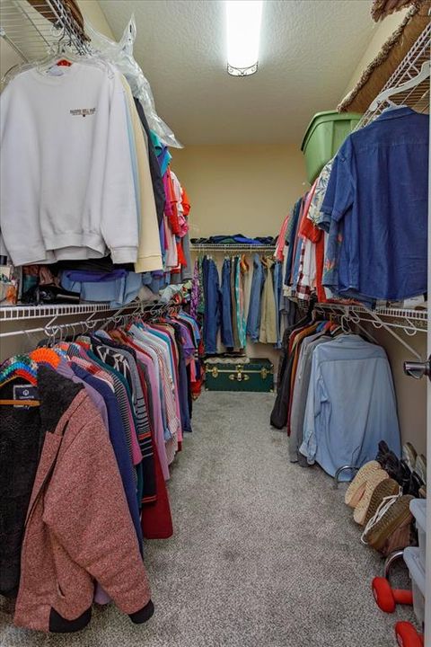 Generous primary bedroom walk in closet