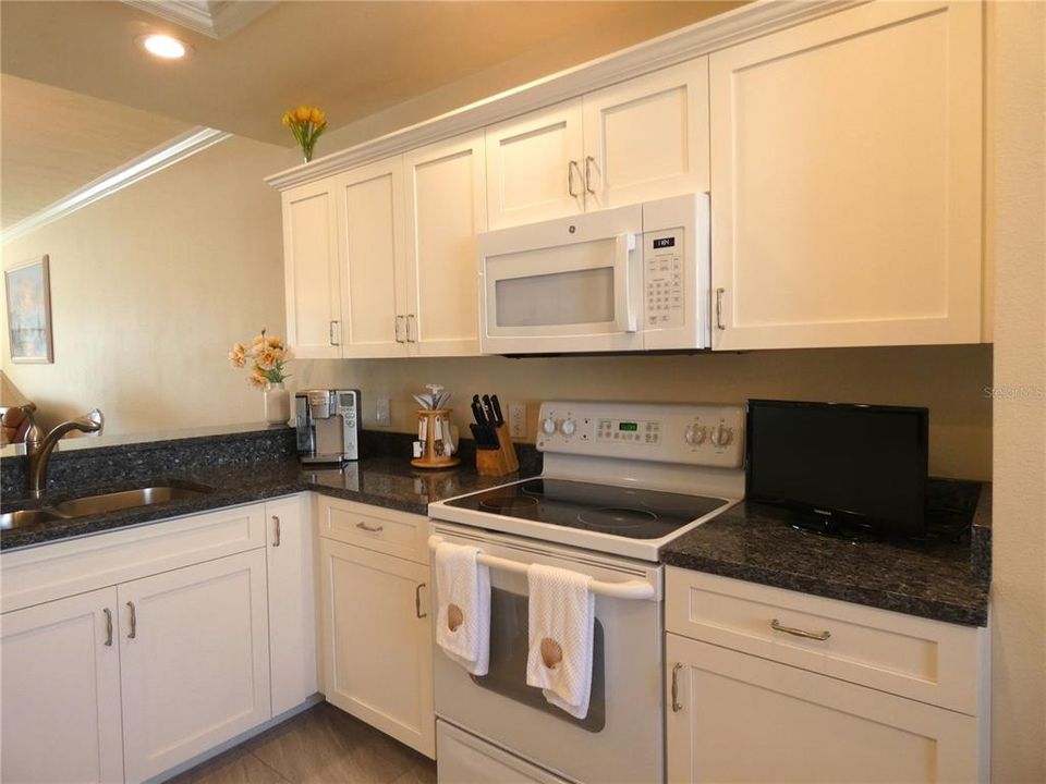 Newer cabinets - granite countertops.