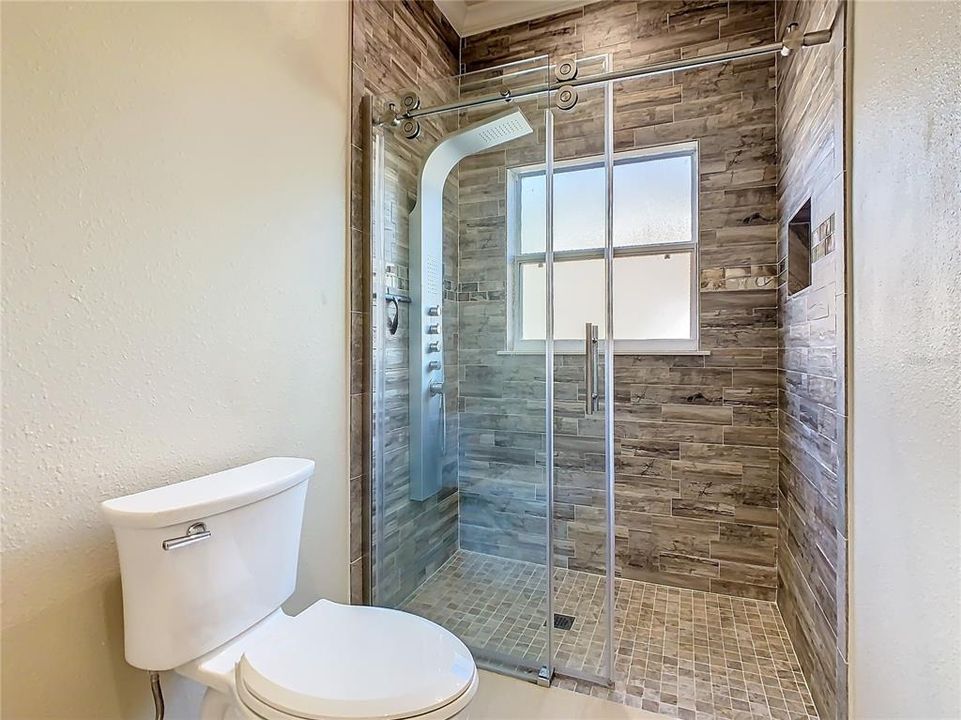 Upgraded Walk-in Shower in Guest's Bathroom.