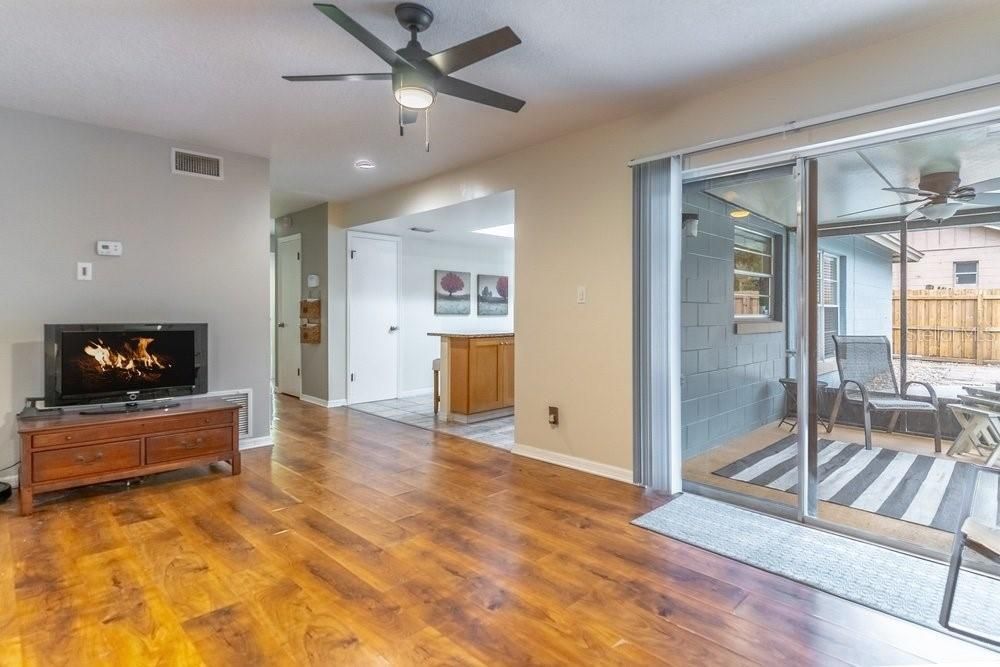 living room access to the screened-in patio