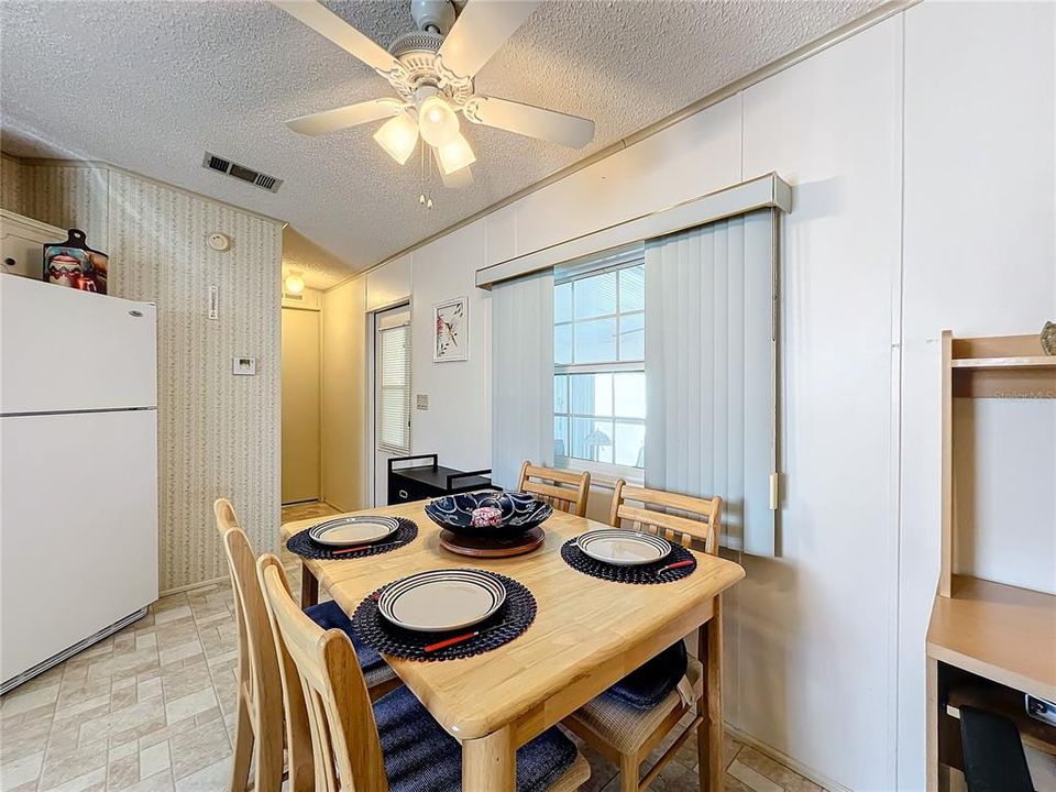 Dining area and view into the laundry room