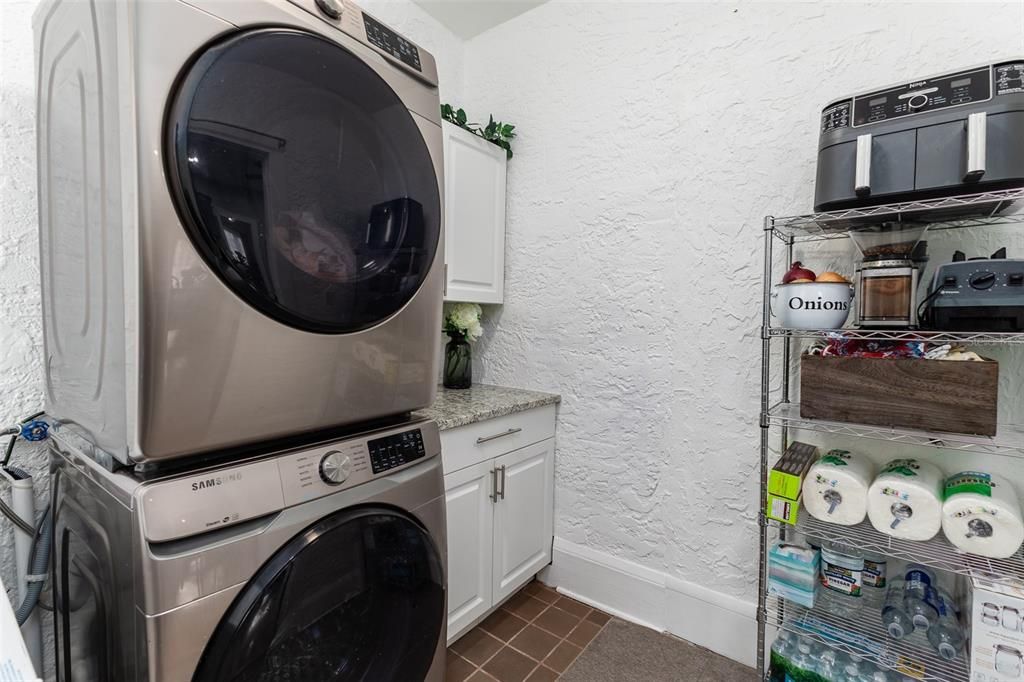 Spacious Laundry Room with additional storage located just off the kitchen