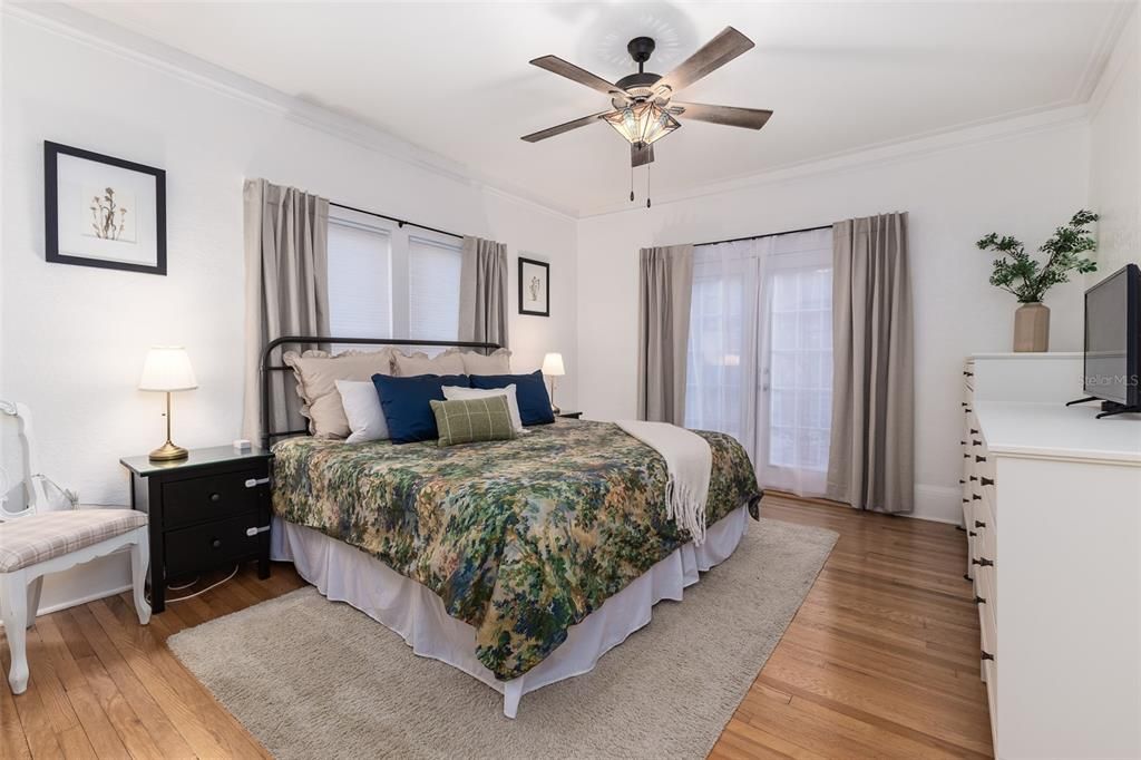 Primary Bedroom featuring French doors leading out to the side patio