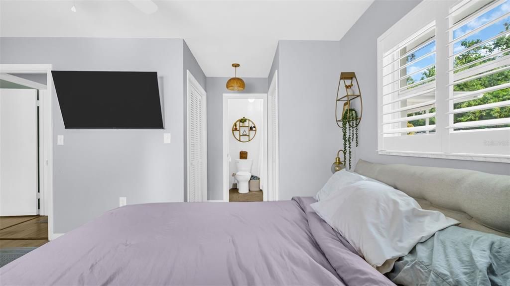 His and Hers Closets in Hallway that Leads to Bath