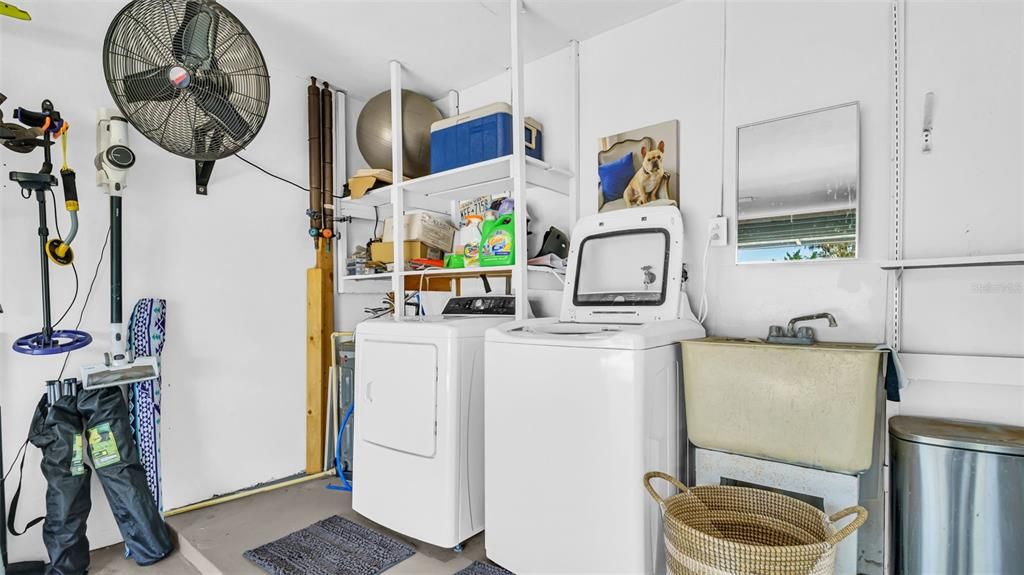 New Washer and Dryer. Utility Sink. Wall Mounted Fan in Two Car Garage with Tons of Storage.