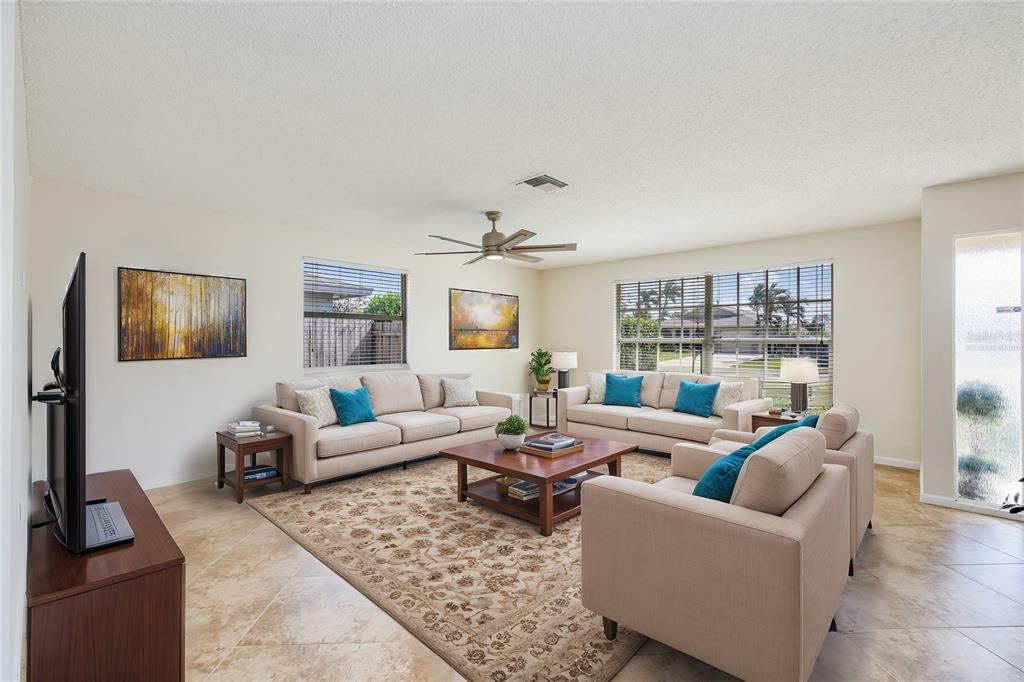 Virtually Staged Living Room looking out front windows.