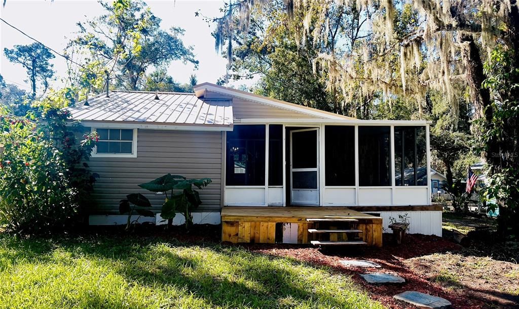 Rear of home with screen room