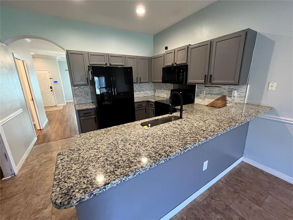 Can add bar stools at the granite kitchen counter