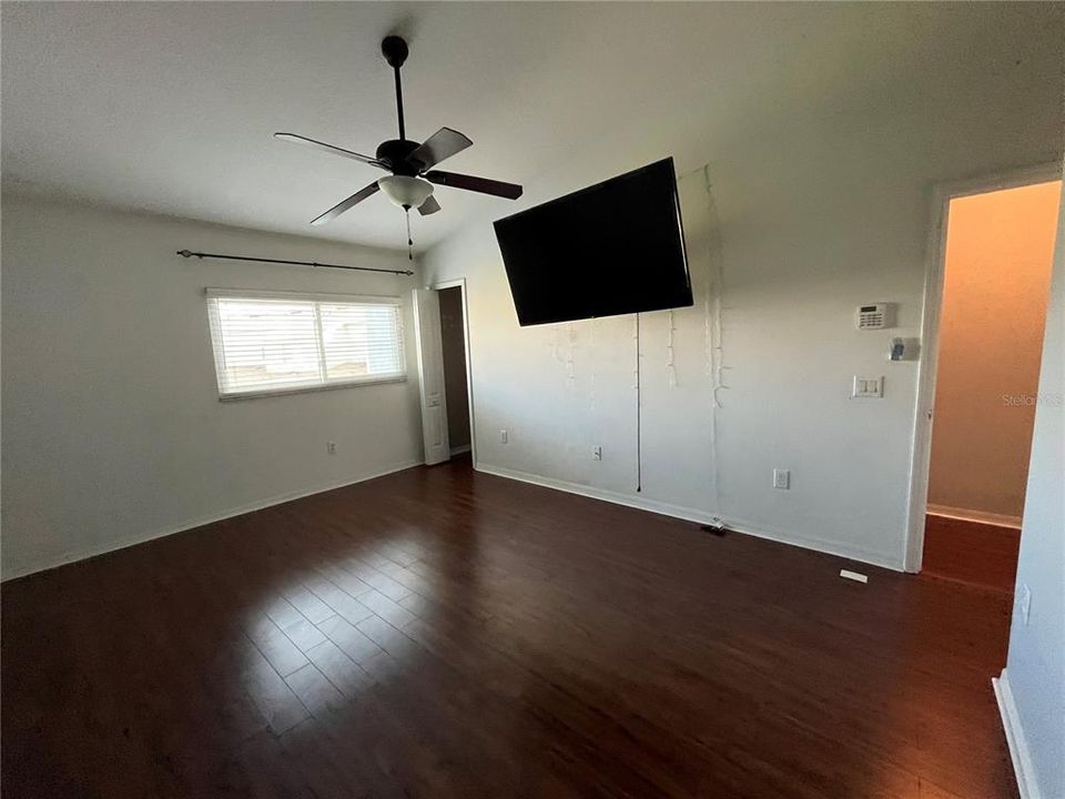 Primary Bedroom with wood floors