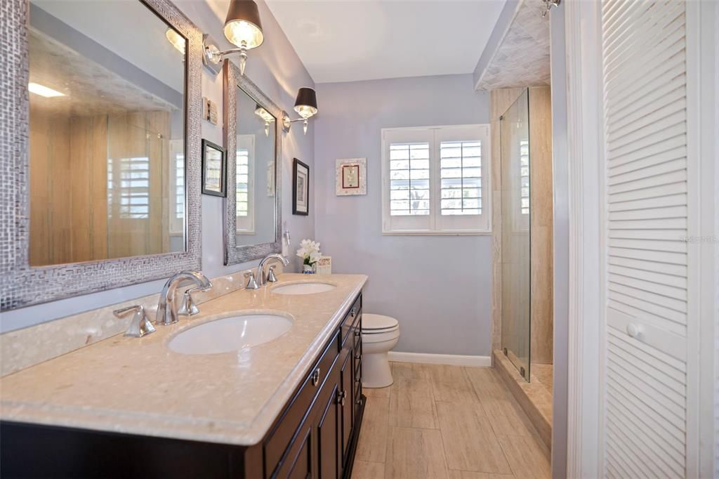 Main Bathroom with double sinks and walk in shower