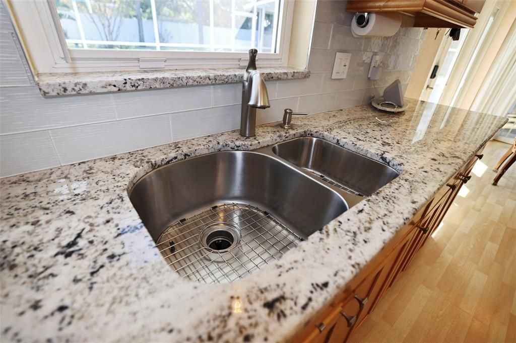 Double Stainless sink view is to the pool