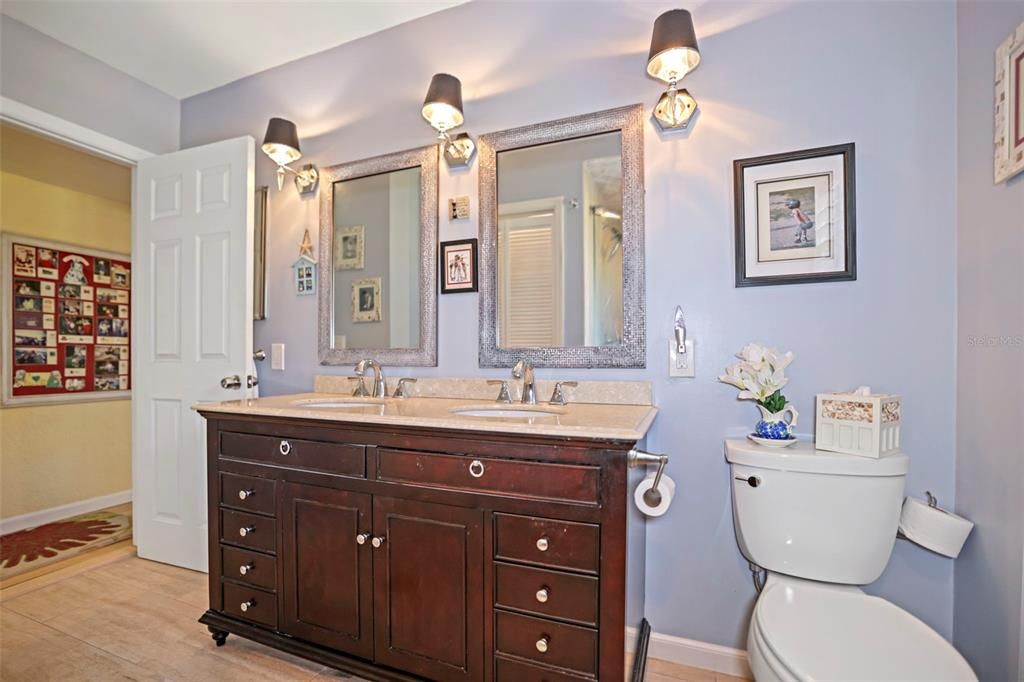 Main Bathroom with double sinks and walk in shower