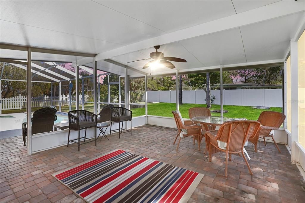 Huge screened lanai 300+ sq ft with a lovely view of the large vinyl fenced yard and view into the pool