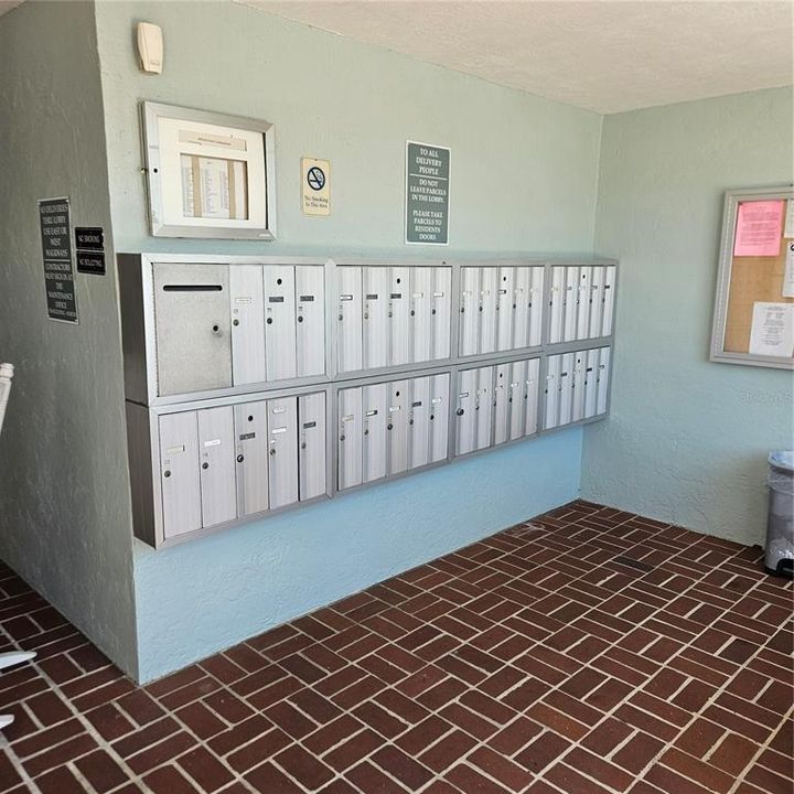 Mailboxes inside the front door of the building